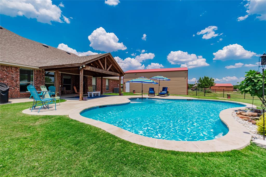 Welcome to the perfect blend of comfort, space, and outdoor living in Royse City. Situated on 1.5 acres+, this beautifully maintained 4-bedroom, 2-bath home offers 2,425 square feet of thoughtfully designed living space and an incredible backyard retreat. Step inside to an open-concept layout with high ceilings, crown molding, and rich wood flooring that create a warm and inviting atmosphere. The spacious living room features a stunning stone fireplace and large windows that bring in natural light while offering views of the backyard oasis. The kitchen is designed for both everyday living and entertaining, featuring granite countertops, stainless steel appliances, tile backsplash, abundant cabinetry, and a large breakfast bar that opens to the dining and living areas. A versatile flex space currently used as a game room provides the perfect area for a pool table, media room, or second living space. The private primary suite offers plenty of room to relax and includes a spacious ensuite bath with dual vanities, soaking tub, separate shower, and large walk-in closet. Step outside and you’ll find a backyard built for entertaining. The sparkling gunite pool (2017) is the centerpiece of the outdoor space and is complemented by a stunning covered cabana, creating a perfect setting for relaxing or hosting gatherings. With wide open views and plenty of yard space, this property offers the privacy and freedom that acreage living provides. Car enthusiasts, hobbyists, or anyone needing extra space will appreciate the impressive 20x40 workshop (2015), offering ample room for vehicles, storage, and projects. New outside HVAC (2019) New inside HVAC (2025) Located in Royse City with easy access to nearby amenities while still enjoying the peace of country-style living, this property offers the space, features, and outdoor lifestyle that are increasingly hard to find. HVAC, entire system-attic & outside units-all checked and filter replaced (Feb 2026)