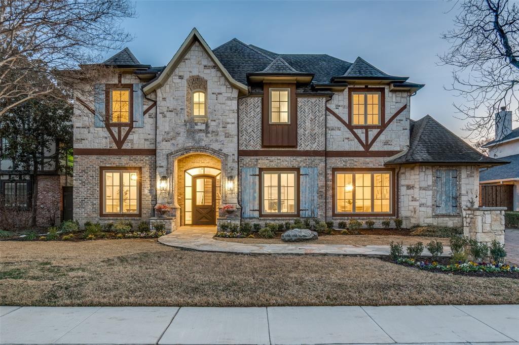 Beautifully positioned in a premier Preston Hollow corridor, this classic Tudor-style residence offers timeless charm, generous living spaces, and an exceptional location nestled between Preston and Hillcrest. Step inside to an open, light-filled floor plan highlighted by high ceilings, elegant architectural details, and warm finishes designed for both everyday living and entertaining.
The first floor features a spacious primary suite complete with a comfortable sitting area, along with an additional first-floor en-suite bedroom and a private study—ideal for multi-generational living or a home office. The chef’s kitchen, accented with rich wood beams, opens seamlessly to the inviting family room, where a striking cast stone fireplace creates a welcoming focal point.
Upstairs, three large en-suite bedrooms are thoughtfully arranged near a generous game room, media room, and bonus exercise or flex space, providing exceptional versatility for today’s lifestyle. A serene second-story balcony overlooks the very private backyard, offering a peaceful retreat surrounded by mature landscaping.
Additional highlights include abundant storage throughout, a three-car garage, and a layout designed for comfort, functionality, and entertaining. Located just north of Walnut Hill Lane, this home enjoys convenient access to top private schools, fine dining, shopping, and major thoroughfares—all while offering a quiet, neighborhood feel.
This Preston Hollow gem blends classic Tudor elegance with flexible living spaces in one of Dallas’s most desirable locations.
