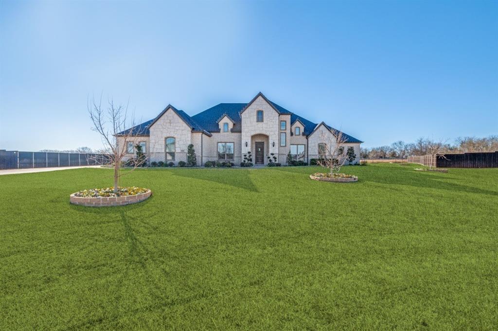 Welcome to this custom luxury family home situated on 1.01 acres in the serene and sought-after Legacy Estates community. Thoughtfully designed for both everyday living and entertaining, this exceptional property offers 4 bedrooms, 4 full baths, an open-concept living area, media room, game room, private office, and an upstairs playroom.

The interior blends modern elegance with timeless craftsmanship, featuring hand-scraped oak floors, high ceilings, and abundant natural light throughout. The gourmet kitchen is a chef’s dream, highlighted by a large bar island, custom tile backsplash, walk-in pantry, butler's pantry, WOLF range with double ovens and built-in wok station, and a Sub-Zero built-in refrigerator,freezer.

This home is equipped with a full ELAN home automation system, providing centralized control of music across 13 listening zones, home theater, Lutron motorized shades, lighting, and three-zone climate control, offering both comfort and efficiency.

The expansive primary suite serves as a private retreat, complete with a spa-inspired ensuite bath featuring a walk-in shower and a private coffee bar with built-in refrigerator. Three additional bedrooms and multiple flexible living spaces provide ample room for family, guests, and entertaining.

Outdoor living is equally inviting with a large enclosed patio, ideal for morning coffee or evening relaxation while overlooking the spacious backyard. The property also includes a concrete storm shelter located in the backyard, offering added safety and peace of mind.

Additional highlights include a massive 1,100 sq ft three-car garage with epoxy flooring, a 25kW Cummins whole-home generator with a 250-gallon underground propane tank, and a full irrigation system with dedicated tree bubblers.

This home offers a rare combination of luxury finishes, advanced technology, and thoughtful design in a peaceful estate setting.