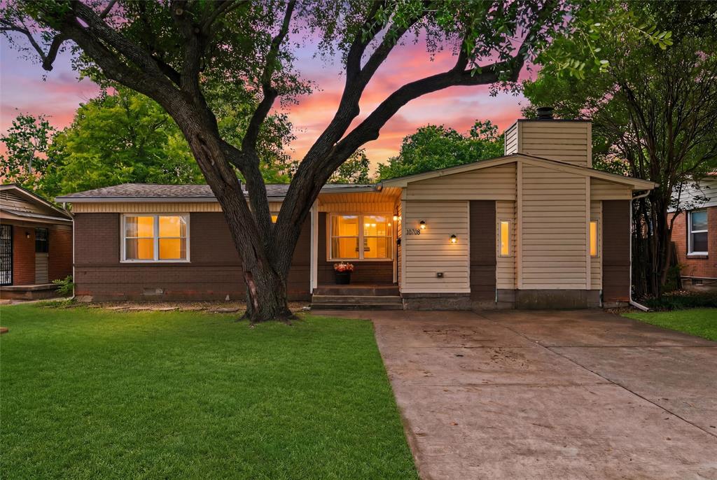 Beautifully maintained and full of charm, this inviting single-story home is nestled in a highly desirable East Dallas neighborhood with mature trees and exceptional convenience. The spacious living room features a painted brick fireplace, creating a warm focal point for everyday living and entertaining. The functional floor plan flows seamlessly into the dining area with French doors opening to a covered patio, while the kitchen offers abundant cabinetry, generous workspace, and an open connection to the main living areas. Three comfortable bedrooms feature hardwood flooring and ceiling fans, and the bathroom includes a walk-in shower with built-in shelving. Step outside to enjoy the covered patio overlooking a large, tree-shaded backyard complete with a detached storage building. Ideally located just minutes from shopping, dining, major highways, and in close proximity to Bishop Lynch High School, this home offers the perfect blend of comfort, convenience, and timeless appeal.
