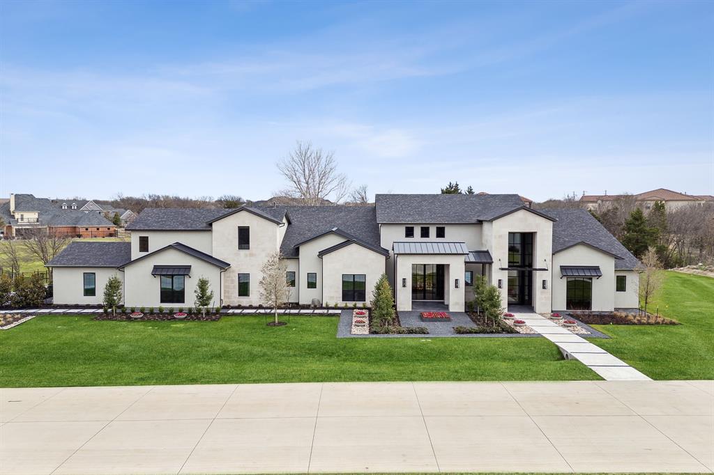 Stunning materials, gorgeous details, & clever architecture define this brand new 5-bed, 5.2 bath home. Generous room sizes & open floor plan create a spacious flow while white oak flooring, quartzite counters, marble tile, & champagne brass finishes wrap you in luxury. Entertaining is a breeze! Huge kitchen boasts Thermador appliances, wine room, & hidden prep kitchen opening to your outdoor summer kitchen. Both great room and media room open fully to backyard retreat with enormous, covered patio, pool, & fire pit. Game room hosts indoor activities. Private life is equally impressive, with a primary suite including private exercise room & a custom closet connected to laundry. All secondary bedrooms have private baths, plus two beautiful powder baths for guests. Study includes hidden closet plus second work room. 4-car oversized garage has space for workbench or storage, with staircase to attic above. Minutes from 75-121 for easy commute around DFW yet feels like you’re miles away.
