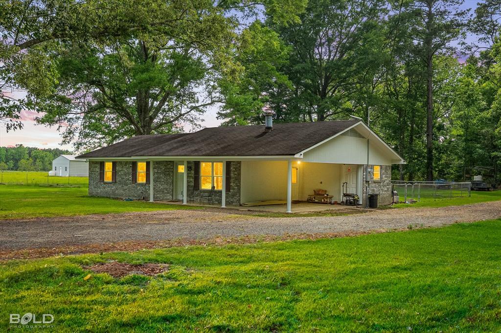 Welcome to peaceful country living at 186 Hughes Road in Coushatta, where privacy, functionality, and outdoor living come together. One of the first things you’ll notice is the impressive 30x30 workshop complete with a 10-foot overhang porch, water access, and electricity already in place. The shop also includes a 10x10 lawn mower room with a roll-up door and an additional 12x20 drop shed or boat covering, creating the perfect setup for hobbies, storage, equipment, or recreational vehicles.

Built in 1980, this remodeled 3 bedroom, 2 bathroom home offers the quiet setting so many buyers are searching for.

Inside, the home has been updated with refreshed finishes while maintaining warmth and character throughout. The primary bedroom features beautiful natural woodwork that adds charm and a cozy custom feel. The layout is functional and inviting, making it a great option for full-time living, a weekend retreat, or those looking to downsize without sacrificing outdoor space.

Step outside and enjoy the peaceful surroundings with no close neighbors, giving you the privacy and seclusion that country living provides. A small fenced yard behind the home is perfect for pets, gardening, or a secure outdoor space.

Located just minutes from Grand Bayou Reservoir, this property is ideal for those who love fishing, boating, and spending time outdoors. The Coushatta location also offers convenient access to town amenities, schools, and local shopping while still providing the relaxed pace of rural living.

If you have been looking for an updated home with privacy, workspace, and room for your toys, this one is worth a look.
