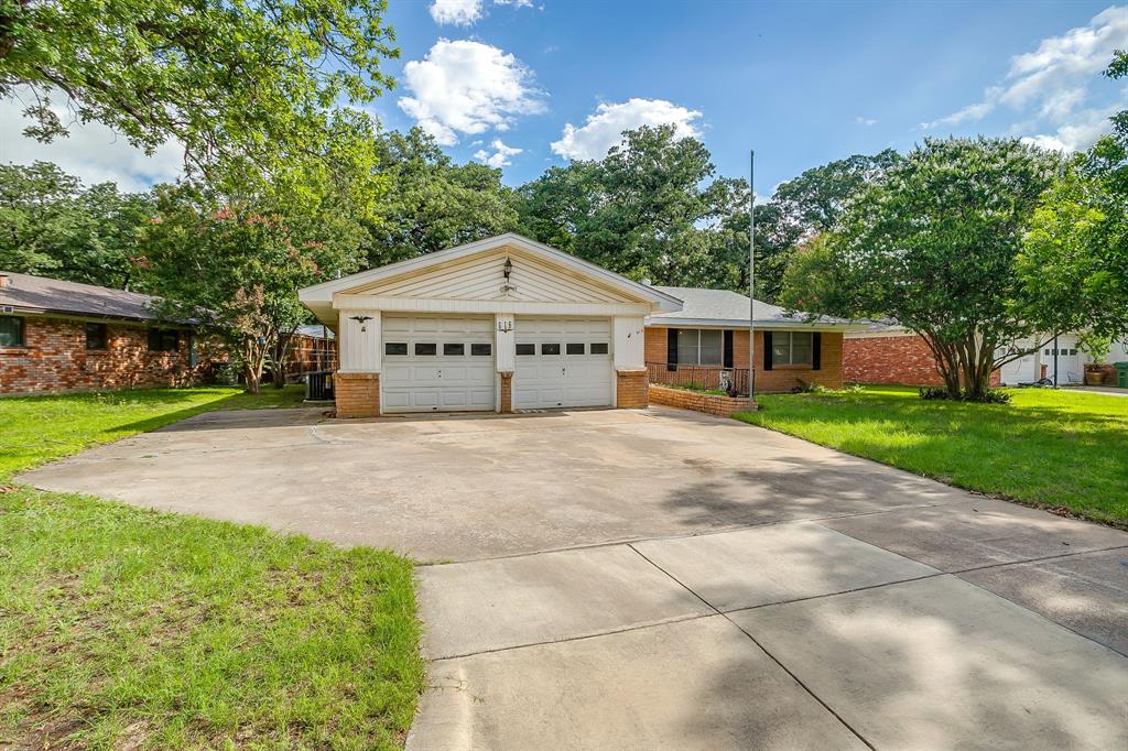 Welcome to 616 Post Oak, a 3-bedroom, 2-bath home nestled among mature trees in an established Hurst neighborhood. Designed for comfortable everyday living, this home features an open-concept layout that seamlessly connects the living, dining, and kitchen spaces, creating an inviting atmosphere for both relaxing and entertaining.  Enjoy year-round outdoor living in the enclosed porch overlooking the private backyard. The property also includes two outdoor storage sheds, providing plenty of space for tools, hobbies, and extra storage.  Peace of mind comes easy with recent updates to all major systems, including a new HVAC system and water heater installed in 2025, as well as a roof and electrical panel that are both just two years old. Combining functional updates with timeless charm, this home offers a convenient location close to shopping, dining, parks, and major commuter routes. Home is being sold as is.