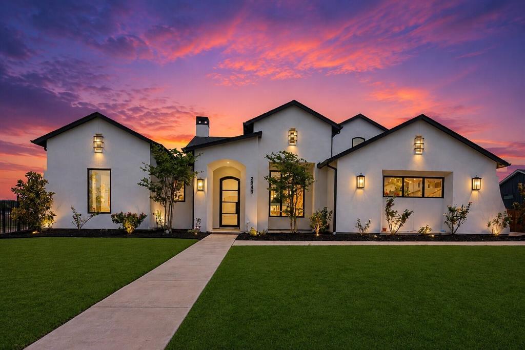 *CUSTOM LUXURY HOME ON A HALF-ACRE CORNER LOT!!* DESIGNER FINISHES THROUGHOUT!!*
Welcome to this extraordinary custom-built Penta Via residence situated on a sprawling half-acre corner lot in the prestigious The Vines community. This luxurious 5-bedroom, 5.5-bath home with a 3-car garage showcases elevated designer finishes, soaring ceilings, hardwood flooring, cathedral-style arched entryways, exposed wood beam accents, designer lighting, and expansive open-concept living spaces filled with natural light. The stunning living room features a dramatic floor-to-ceiling porcelain gas fireplace, custom floating shelving, and expansive sliding glass doors that create seamless indoor-outdoor living. Designed for upscale entertaining, the chef’s kitchen offers an oversized island with breakfast bar seating, quartz countertops, designer porcelain backsplash, custom soft-close cabinetry, porcelain farmhouse sink, premium 6-burner gas range with vent hood, and an oversized walk-in pantry with extensive built-ins.

The spa-inspired primary suite features floor-to-ceiling porcelain tile, an oversized steam shower with dual showerheads and dual-entry access, freestanding soaking tub, dedicated makeup vanity, and a custom walk-in closet with built-ins. Additional highlights include a private secondary first-floor guest suite, an additional private bedroom with separate garage and patio access, full ensuite bath and walk-in closet, dedicated executive office with custom built-ins and French doors, oversized media room with sound upgrades, designer utility room, mudroom, pocket doors throughout, and walk-in closets in every bedroom.

The expansive backyard offers endless potential for a resort-style outdoor oasis and is already equipped with an outdoor kitchen area. Conveniently located near shopping, dining, entertainment, and major roadways while offering the luxury, privacy, and lifestyle The Vines is known for.