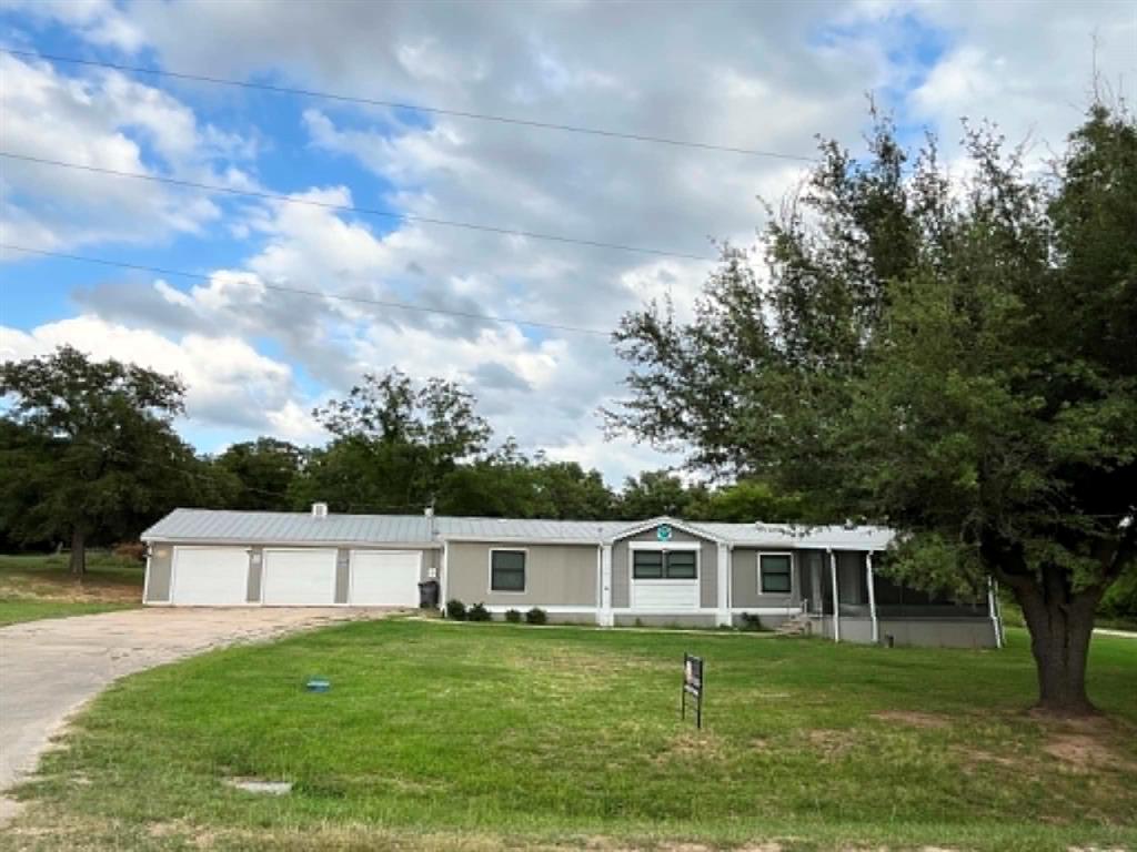 Looking for peace, privacy, and easy lake access? Welcome to Nocona Hills, where beautiful countryside views, abundant wildlife, and a relaxed lifestyle await. Deer can often be seen throughout the day, and residents enjoy access to Lake Nocona, a scenic golf course, stunning sunsets, and a variety of outdoor amenities.
Situated on 0.79 acres, this spacious home offers approximately 2,063 square feet of living space, including an additional 271-square-foot air-conditioned flex room that is not reflected in the appraisal district records. The home features 3 bedrooms, 2 full bathrooms, a 3-car garage, and an open-concept layout designed for comfortable living and entertaining.
The inviting living room showcases a double-sided wood-burning fireplace that serves both the living area and the dining room and kitchen space. The kitchen is equipped with granite countertops and a large center island, making it perfect for family gatherings and entertaining guests.
The primary suite features a walk-in closet with charming barn-style sliding doors and a spacious ensuite bathroom complete with dual sinks, a soaking tub, and a separate walk-in shower. The additional flex room can easily serve as a fourth bedroom, home office, playroom, or hobby room.
Outdoor living is just as impressive. Enjoy the large screened-in front patio, ideal for relaxing and enjoying the outdoors in comfort year-round. The backyard includes an underground storm shelter for added peace of mind.
Living in Nocona Hills provides access to numerous community amenities, including a 50-acre fishing pond, lake access, picnic areas, an RV park for visiting family and friends, a grass landing strip, and a beautiful golf course available for a monthly fee. The community also features 24-hour gated access with guarded security, offering both convenience and peace of mind.
Don't miss this opportunity to enjoy lake living, abundant nature, and small-town charm in one exceptional property.