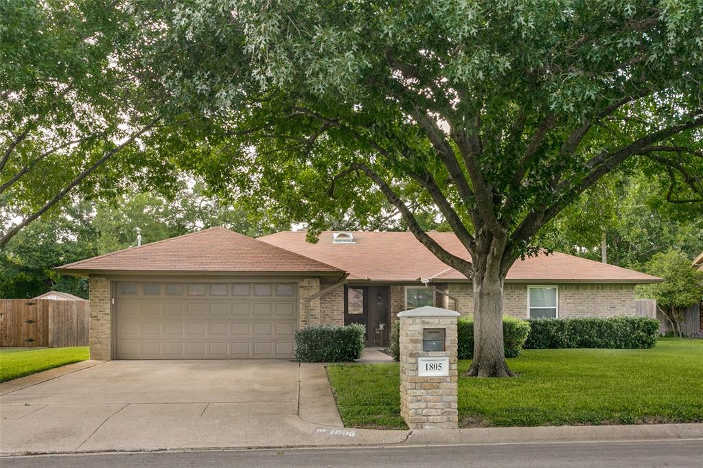 Meticulously maintained single-story with a park-like yard in desirable Timber Creek with no HOA! The beautiful large trees welcome you through the 21x14 brick courtyard into this charming 3.2 with crown molding, wood flooring & fresh paint throughout. The dining room with wood beam accents is a great flex space, serving as a study, playroom, or additional living space. The vaulted living room with skylight has a generous wood-burning brick fireplace with hearth and custom mantle. The kitchen boasts new appliances, granite countertops, a window above the sink, a built-in microwave, an electric stovetop, and freshly painted cabinets with new hardware. The sunny breakfast room has an expansive bay window looking onto the sunroom with partition windows - perfect for Spring. The primary ensuite has a dual-sink granite vanity, a separate shower, a large soaking tub, and two walk-in closets. Both secondary beds are spacious with large closets and direct access to the full bath, which has a granite vanity and a shower-tub combo. Outside, enjoy the newly rebuilt 26ft deck, new fence, park-like yard, and storage shed with electricity. Owners spent over thirty thousand making it their forever home before being relocated. Upgraded electrical panel. New skylights. New appliances. New fence. Rebuilt deck. See the transaction desk for details. Their relocation is your reward!