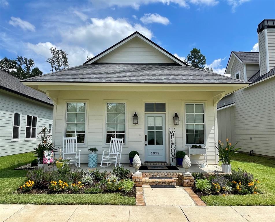 Price Improvement!

Cherished Garden Cottage welcomes you home. An inviting retreat that lives beautifully beyond its square footage. From the New Orleans style front porch to its parkside setting with sunset views, every detail is designed for easy, gracious living. Out back, a thoughtfully curated garden and outdoor living space create a peaceful escape to unwind or entertain.

Inside, the layout is just right for gathering with friends or enjoying a quiet evening with a good book. The open living, dining, and kitchen areas flow effortlessly together. The kitchen is crisp and timeless, featuring white finishes, stainless steel appliances, including the refrigerator, and an island perfect for morning coffee or evening conversation. A spacious walkin laundry and pantry keeps everything neatly tucked away, with washer and dryer included for added convenience.

Down the hall, a full bath with tub-shower combination sits conveniently across from the secondary bedroom.

Privately located at the rear of the home, the primary suite easily accommodates a king-sized bed and offers a generous walk-in closet. The ensuite bath features abundant counter space and a beautifully tiled walk-in shower.

Step outside to an enchanting garden retreat. A covered patio with gas grill connection and twinkling lights sets the tone for relaxed evenings. Lush plantings of hydrangeas, roses, blueberry bushes, and more add charm and color, while the fully fenced yard provides privacy and space for both pets and bare feet in the grass. The garage-carport combination enhances the open feel, complemented by a large storage room to keep everything in its place. An EV plug is already in place, and the alley loaded drive offers ample parking for guests.

It’s more than a home. It’s a place to settle in, slow down, and stay awhile.

Enjoy the Provenance lifestyle and all it has to offer in this charming cottage.