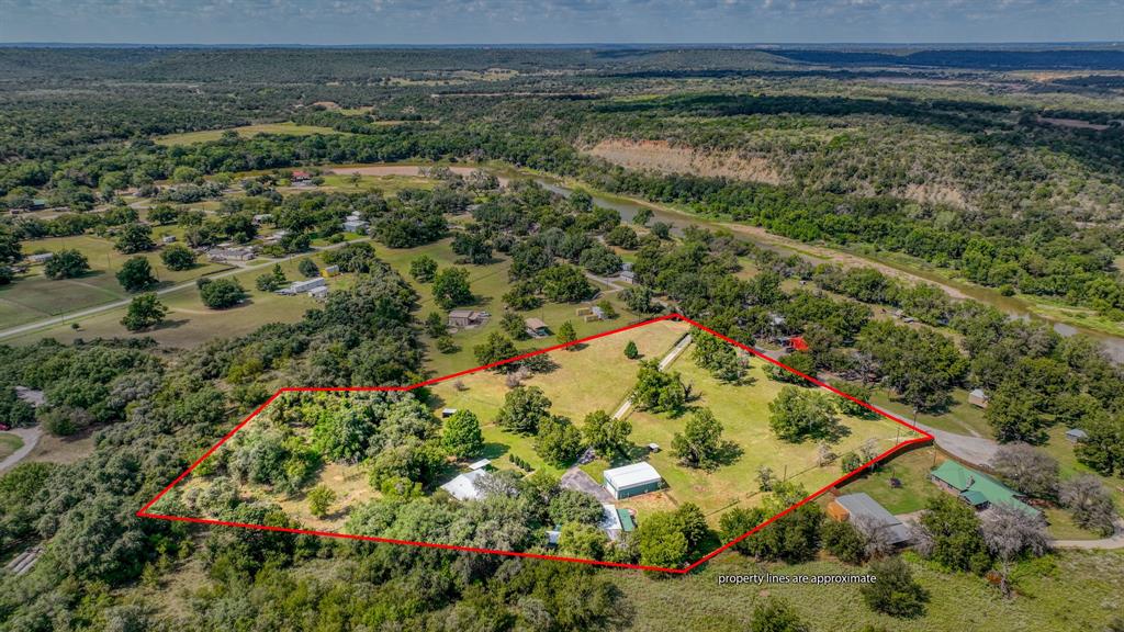Rare opportunity to own 6.3 ag-exempt acres near the Brazos River with no HOA. This well-maintained 3-bedroom, 2-bath home offers peaceful country living surrounded by mature oak trees, large acreage tracts, and scenic rural views. Cross-fenced acreage provides an ideal setup for livestock, agricultural use, or a hobby farm. This property could also be used for multi-generational living by adding a second home! 

Recent updates include a metal roof, newer windows, fresh exterior paint (2024), updated interior paint, and new carpet. The remodeled kitchen features cherrywood cabinetry and a five-burner gas range, while the guest bath offers an updated walk-in shower.

Enjoy the view from the sunroom or relax on the oversized deck overlooking the property. Additional improvements include a shop, oversized garage, RV garage, lean-to, sheep shed, and a hunter's cabin with potential for guest quarters, a studio, or retreat space. Sheep may convey to assist in maintaining the agricultural exemption.

Residents enjoy access to the Brazos River for fishing, kayaking, and outdoor recreation. Ideal as a full-time residence, weekend getaway, or investment in Texas country living. Property recently appraised for the sales price! Back on market due to buyer financing; no fault of sellers. CONTACT AGENT TO DISCUSS FINANCING OPTIONS.