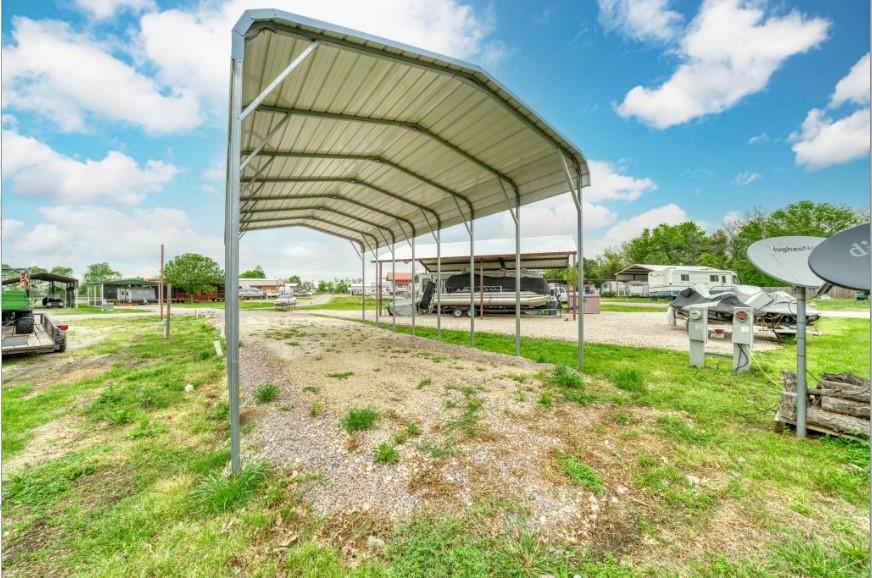 This lot is situated on 0.055 acres of land with a gorgeous lake view of Richland Chambers, providing serenity & peace! The lake offers ample opportunities for fishing, boating, & other water-based activities, making it an ideal location for nature enthusiasts & outdoor lovers. You'll enjoy fishing at your fingertips in one of the best fishing lakes Texas has to offer & the third largest in the state! Bring your RV for weekend trips, long-term stays, or as a rental to other fellow fishermen! This lot is complete with a 35 FT long RV Carport, two sewer & two water hookups, 30 & 50 amp, & 110 amp plugs, & is less than 350 yards from the boat dock & fishing pier. Full access to the clubhouse, laundry mat, pool, & park, all great locations to socialize & relax. One of the most alluring features of this RV land lot is its beautiful sunsets. The stunning views provide a perfect end to the day, making it an ideal place to unwind & enjoy the simple pleasures of life.