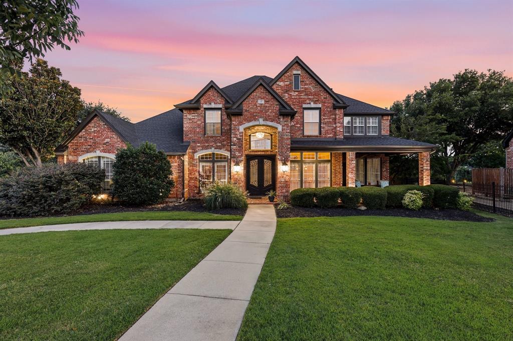 Welcome to LUXURY LIVING in the prestigious golf course community of Bridlewood! Upon arrival, the impeccable curb appeal, manicured landscaping and stunning custom iron front doors set the tone for this exceptional home. Inside, you'll discover a beautifully updated interior featuring light and durable luxury vinyl plank flooring, fresh neutral paint, decorative lighting and a thoughtfully designed open floor plan filled with natural light. The office is enhanced with stylish barn doors, while the spacious living areas seamlessly blend comfort and elegance. The chef-inspired kitchen has been refreshed with all-new stainless steel appliances, a gorgeous new backsplash, granite countertops and generous space for food prep. Designed for both entertaining and everyday enjoyment, this home boasts an incredible media room complete with theater seating, large screen, surround sound, wet bar, beverage and snack station. A high-tech audio system extends throughout the interior and outdoor living areas, complemented by a full camera security system with dedicated monitors. Step outside to your private backyard oasis featuring a sparkling diving pool with new filter, heater, and customizable multi-color lighting. The outdoor kitchen with premium Coyote grill is perfect for hosting gatherings, while mature landscaping provides privacy without sacrificing the breathtaking panoramic golf course views. Enjoy morning coffee or evening sunsets from the expansive second-story balcony overlooking the fairways and backyard oasis. Additional updates include ALL NEW AC SYSTEMS, NEW GARAGE DOORS, ELECTRIC SHADES, PLANTATION SHUTTERS and modern finishes throughout. This rare Bridlewood masterpiece offers the perfect combination of elegance, technology, comfort, and one of the most desirable golf course settings in Flower Mound. This is not just a meticulously maintained home—it’s a lifestyle. Zoned for LISD! Short distance to DFW Airport! AN ENTERTAINER'S DREAM HOME!