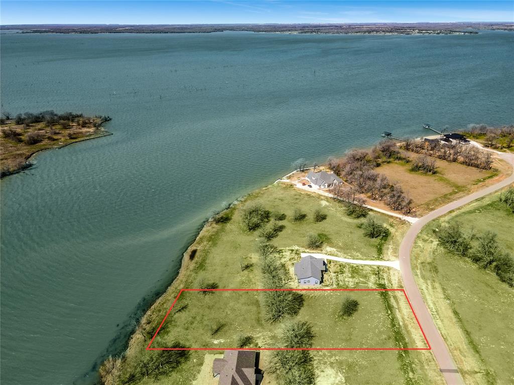 ***$5,000 towards buyers closing costs*** Lakefront opportunity with lots of waterfront footage at Admiral Shores, located on the shores of beautiful Richland Chambers Lake, one of the largest lakes in Texas!! Build your dream home on this lot with plenty of lake front shore and gorgeous lake views!! Enjoy the beautiful sunsets with several large trees already established. Water is deep enough to build a boat slip and paved roads are in.  Utilities are available now and some new owners are already building their homes on the lakefront lots. Only an hour from downtown Dallas! Don't miss this opportunity!