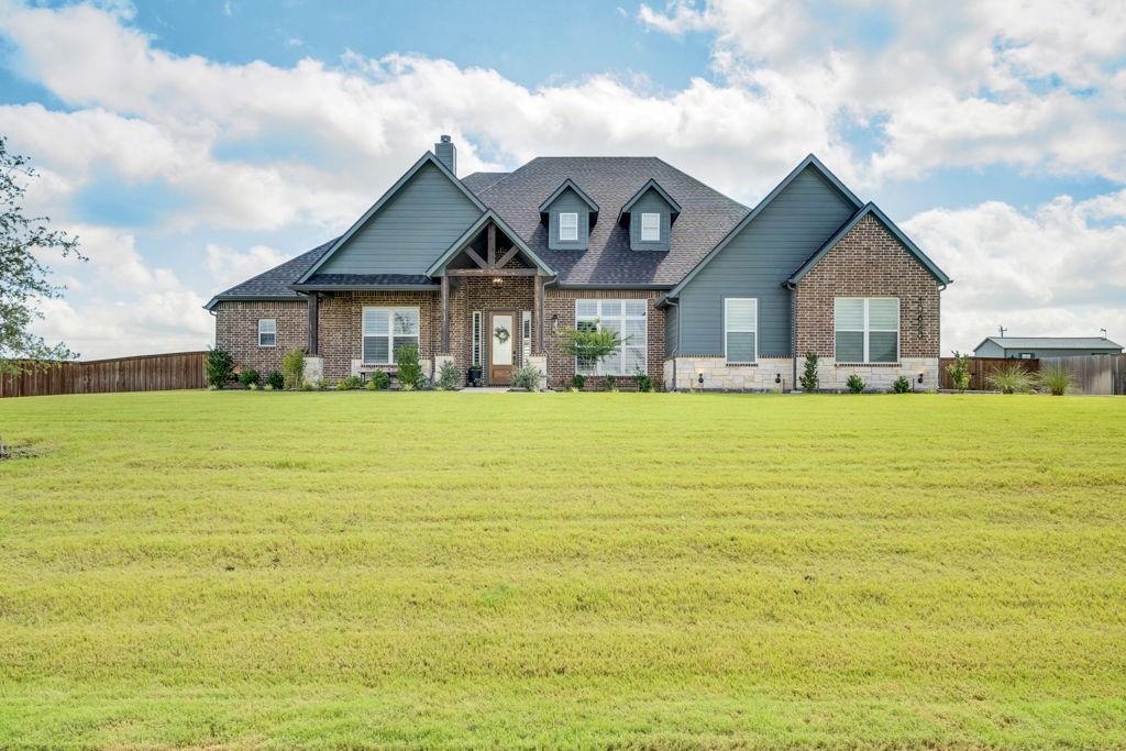 Luxury Acreage Living in Matthews Farms!
Welcome to 10630 Barleycorn Way in Venus, Texas, where custom craftsmanship, thoughtful design, and wide-open space come together on over an acre in highly sought-after Matthews Farms and Maypearl ISD.  Built by the highly covet4ed Canyon Creek Custom Homes. This stunning single-story home offers approximately 2,824 square feet of beautifully designed living space featuring 4 bedrooms, 3 full bathrooms, a private office or whiskey room, huge covered patio, and an oversized 3-car garage.
Step inside and immediately notice the soaring vaulted ceilings with exposed beams, rich hand-scraped hardwood floors, and a dramatic wall of windows that floods the home with natural light while showcasing views of the expansive backyard. The open-concept living area centers around a beautiful fireplace with custom built-ins, creating the perfect gathering space for family and friends.
The chef-inspired kitchen features a large island, abundant cabinetry, walk-in pantry, and seamless flow into the dining and living areas—ideal for entertaining. The private primary retreat offers a spa-like bath complete with a freestanding soaking tub and oversized walk-through shower with dual shower heads. Every closet has been thoughtfully designed with additional seasonal storage racks for maximum organization.
A versatile 4th bedroom with sliding doors opens directly to the covered vaulted patio, creating an effortless indoor-outdoor lifestyle but would also serve well as a mother in law suite with its own dedicated wing of the home. Whether you're hosting guests in your whiskey room showing off your fireplace made from Reclaimed wood from the Jim Beam Distillery, enjoying quiet evenings under the stars, or planning your dream backyard oasis, the acre-plus homesite provides endless possibilities. Located outside city limits, you'll enjoy the peace and privacy of country living while maintaining convenient access to all major highways.