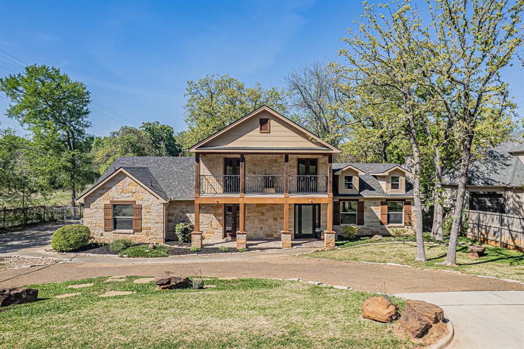 Discover luxury living in this stunning 4-bedroom, 3.5-bath estate nestled on 1.4 acres in the highly sought-after Colleyville area. This exceptional home offers the perfect blend of elegance, comfort, and modern upgrades throughout. Step inside to be greeted by soaring ceilings and an abundance of natural light, creating an open and inviting atmosphere. The thoughtfully designed floor plan features spacious living areas ideal for both entertaining and everyday living.  The gourmet kitchen is a chef’s dream, complete with granite countertops, high-end finishes, and ample space for gathering. Every detail in this home has been carefully curated, showcasing upgrades galore that elevate both style and functionality.  Retreat to the luxurious primary suite, where you’ll find a spa-inspired bathroom featuring a classic clawfoot tub, a large walk-in shower, and refined finishes that create a serene escape.  Enjoy outdoor living at its finest with two private balconies, a large patio perfect for entertaining, and expansive grounds offering privacy and endless possibilities.  This one-of-a-kind property combines timeless elegance with modern luxury—an incredible opportunity to own a premier home in Colleyville.