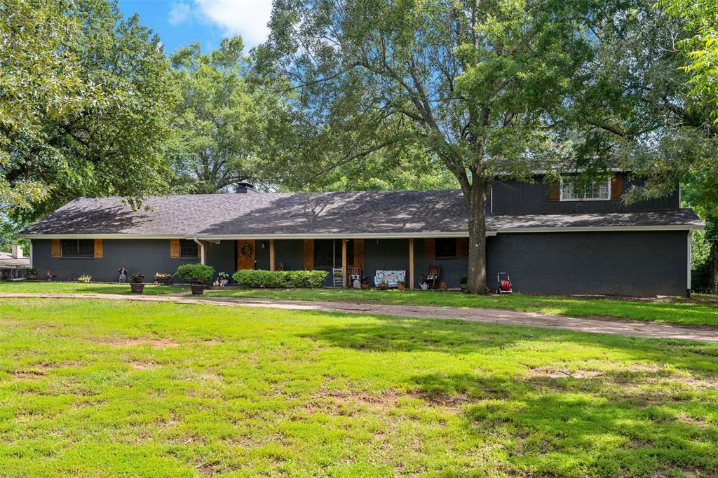 Nestled on a peaceful .69-acre lot in the highly sought-after Reno area, this quiet and inviting 3-bedroom, 2-bath home offers space, comfort, and timeless style. Located within the North Lamar School District, the property is shaded by mature trees and features a circle drive for easy access and curb appeal.

Step inside to an open floor plan that includes a spacious living room and a warm, inviting dining room with a fireplace, perfect for gathering with friends. The kitchen is a chef’s delight with customs cabinets, an island with sink, all with beautiful countertops. A pantry, butler’s pantry leads to a utility room, all flowing into a cozy breakfast area.

The primary suite is thoughtfully designed with a private, suite-style layout, offering a serene retreat. Upstairs, you’ll find a large game room, ideal for entertainment, hobbies, or an additional living space.

Enjoy outdoor living on the expansive back patio, surrounded by nature and privacy. There is also a well which is great for irrigation! With its ideal layout, desirable location, and charming features, this home is a rare find in the Reno area.