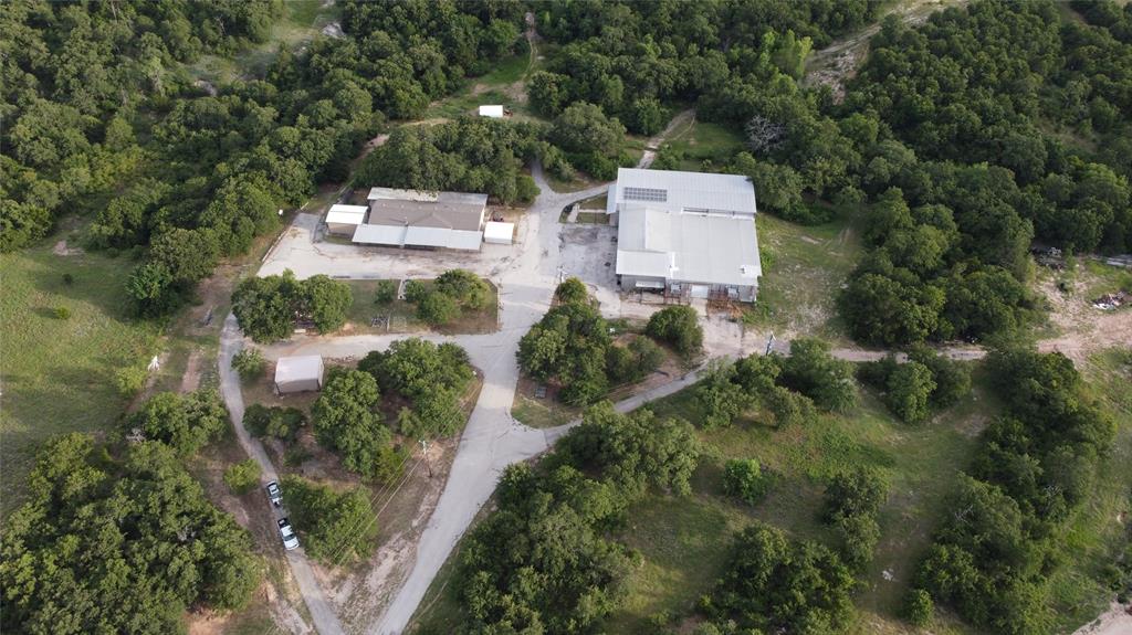 10.75-Acre Multi-Use Property with Multiple Dwellings, Shop & Wells Versatile and well-equipped, this property offers room to live, work, and grow. The main home is a spacious double-wide mobile with 4 bedrooms, 3 bathrooms, an office, living room, dining room, and kitchen. Enjoy covered cement porches and a carport for added convenience. A 20x25 detached guest house features 1 bed 1 bath, perfect for extended family or rental income, Plumbing will need maintenance. An additional 20x25 office storage building provides space for business or hobbies. The impressive 110x110 insulated shop includes 2 bedrooms, 1.5 bath, a full kitchen, 3-phase power, and its own solar panel system ideal for a business, workshop, or alternative living space. Partial of shop was being converted to be made into a venue. 2 registered water wells supporting all uses (house, shop, outdoor water lines are all ran off the well inside the large shop).  Additional features include 2 detached chicken coops and a greenhouse for year-round gardening. Whether you’re looking for a family compound, homestead, or live-work setup, this unique property delivers flexibility and self-sufficiency. There is a creek that runs through the property behind the residence as well, adding seasonal water source.

There are new kitchen appliances that have been placed in shop, to replace the ones in the house.