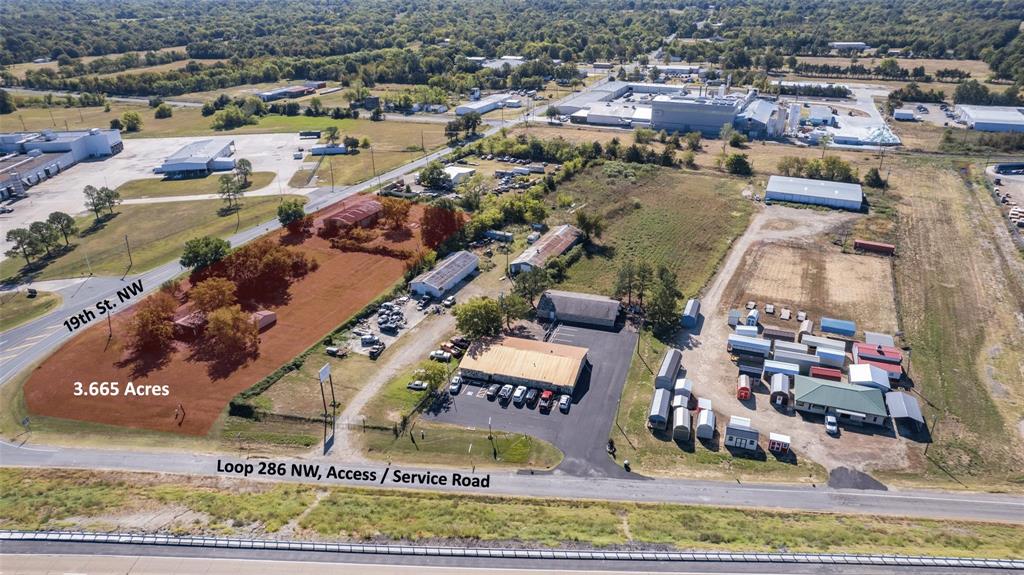 Property is an ideal location for commercial or industry ventures.  Situated at one of the highest-trafficked locations in the county, and offering nearly 1,000 feet of road frontage, this land is an ideal place for a restaurant and fuel station, or an industrial site.  This property is also about a block from the railroad, and centered in a booming industrial area with American SpiralWeld Pipe Company having establishing a 146-acre operational base on the west side of the property and bakery - industrial facility on the east as well.  This location affords immediate access to Loop 286, and a prime opportunity for your company.