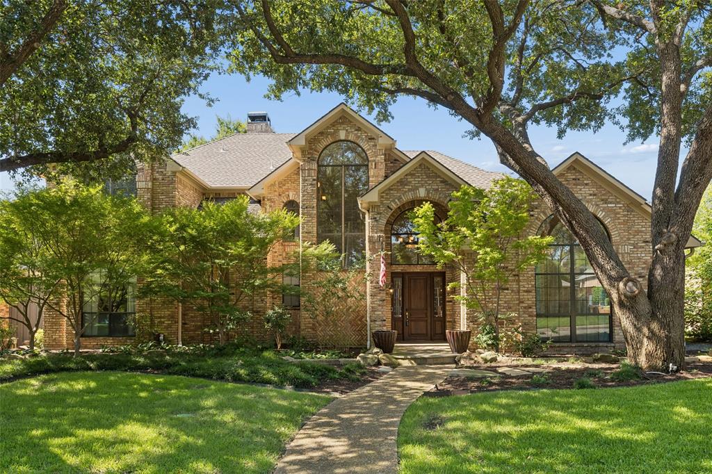Nestled on a premier street in Bent Tree West, this beautifully updated traditional home offers the ultimate outdoor retreat, complete with a sparkling spool, built-in grill, and inviting fire pit. Inside, you'll find an exceptional floor plan featuring 5 bedrooms, 4.5 baths, and multiple living spaces designed for comfortable everyday living. Formal living and dining rooms provide elegant spaces for hosting, while the dramatic two-story family room showcases a soaring wall of windows, extensive molding, custom built-ins, a cozy brick fireplace, engineered wood flooring, and a convenient wet bar, creating the perfect gathering space. The well-appointed kitchen features granite countertops, a gas cooktop, double ovens, abundant cabinetry, generous prep space, and a charming breakfast area with built-ins. The thoughtful layout includes a spacious primary suite and a secondary bedroom with an ensuite bath on the main level, making it ideal for guests or a home office. The updated primary bath features dual granite vanities, a freestanding soaking tub, a separate shower, a large walk-in closet, and private access to the backyard. Upstairs offers two additional bedrooms connected by a Jack-and-Jill bath, along with a bonus room. A private staircase leads to an additional versatile flex room featuring custom built-ins, dual Murphy beds, and a private ensuite bath, making it an ideal fifth bedroom, game room or media room. Step outside to your own private backyard retreat featuring a spool, perfect for relaxing year-round, along with a covered patio, built-in grill, fire pit, low-maintenance artificial turf, mature landscaping, and a privacy fence—creating an ideal setting for outdoor entertaining and everyday enjoyment. Located in highly sought-after Plano ISD, this home is just minutes from the Dallas North Tollway, George Bush Turnpike, premier shopping, dining, parks, and recreation, offering an exceptional combination of space, functionality, and location.