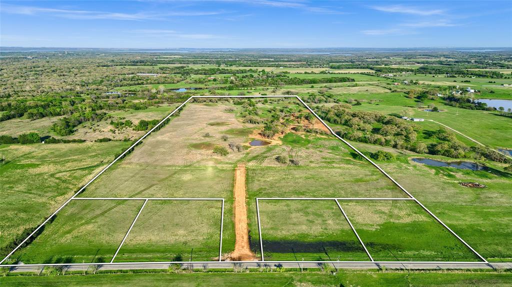 Positioned just minutes from the shores of Lake Texoma, this expansive 1.181-acre homesite offers the perfect balance of peaceful country living and easy access to vibrant nearby destinations. Located near the entrance of the scenic Rock Creek Resort community, this unimproved lot presents an excellent opportunity to build your custom home or weekend getaway in one of North Texas’s most desirable recreational areas. Enjoy the convenience of being a little over an hour from the DFW metroplex, 30 minutes from the rapidly expanding Sherman and Denison markets, and just down the road from exciting new developments like the future Hard Rock Hotel & Resort. The Megastar Casino is only five minutes away and you’re not from from Choctaw or Winstar World Casino, providing entertainment and dining close to home. Situated just off FM 901 and US Hwy 377, this property offers smooth access to nearby towns, Whitesboro ISD schools, shopping, and outdoor adventure. Essential utilities are in place to simplify your build—GCEC electric service is available, and water is provided by Northwest Water at the road. Light restrictions are in place to preserve the character and value of the surrounding area, while still allowing flexibility in your home design. Additional acreage is available for those seeking more space or long-term investment potential. Whether you're drawn to the lake, planning a future homestead, or simply looking for a smart land purchase in a growing region, this beautiful tract is a standout opportunity. We have options to purchase 1.181 acres, 1.185 acres, or 54+ acres.