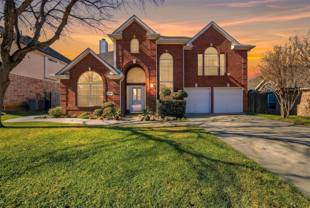 The perfect blend of elegance and comfort awaits for you and your family-call it home! Striking brick curb appeal leads into an interior defined by soaring ceilings, a graceful curved staircase, and abundant natural light that highlights rich hardwood floors. The open-concept living, dining, and kitchen areas flow effortlessly, offering seamless indoor-outdoor living with views of the backyard. The kitchen features a large island, and a walk-in pantry. Outside, your private retreat includes a large pergola, perfect for gathering with family and friends.  The spacious primary suite boasts a serene sitting area and a spa-like ensuite bath with a soaking tub and walk-in shower. Upstairs includes a versatile flex room that can function as a game room, gym, or office.  Conveniently located in central DFW near amenities and highly desired Birdville ISD.