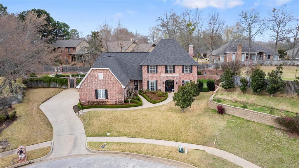 Located on a quiet cul-de-sac in Holly Star, this stunning Hollytree residence offers over 4,100 square feet of thoughtfully updated living space designed for today’s dynamic lifestyle. From the moment you arrive, the exceptional curb appeal stands out, with manicured landscaping and concrete walkways guiding you to multiple entry points. Inside, a freshly painted interior creates a bright and welcoming atmosphere. The home features two spacious living and dining areas that flow seamlessly into the beautifully updated kitchen, complete with granite countertops, an expansive breakfast bar, walk-in pantry, double ovens, built-in microwave, and gas cooktop. The kitchen opens to a warm and inviting family room with a fireplace and direct access to the covered patio—perfect for indoor-outdoor living and overlooking the meticulously landscaped backyard. The well-appointed laundry room includes an oversized storage closet ideal for pantry overflow, along with convenient access to a mud bench, powder bath, and three-car garage. The private primary suite is a true retreat, offering serene views of the terraced backyard and a spa-inspired bath featuring separate vanities, an oversized shower, soaking tub, walk-in closet, and newly added tile with a steam shower upgrade. Upstairs, bedrooms two and three share a Jack-and-Jill bath, while bedroom four enjoys access to its own bath. Additional spaces include a third living area, a dedicated study or office, and a generous game or media room—providing incredible flexibility for work, play, and relaxation. Step outside to a backyard designed for both beauty and entertainment, highlighted by custom retaining walls, a sparkling pool with a new pump, hot tub, newly installed putting green, and upgraded drainage system. A whole-home generator ensures peace of mind year-round. This exceptional property truly must be experienced in person. Schedule your private tour today.
