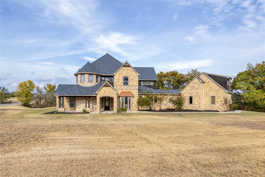 Experience elevated living in this stunning estate, perfectly positioned on a premier 2.96-acre corner lot within the prestigious, gated equestrian community of Rollin Hills Estates. A tranquil creek meanders along the back of the property, creating a breathtaking natural backdrop and an unparalleled sense of serenity. This exceptional two-story residence offers more than 4,300 square feet of refined living space, featuring 4 spacious bedrooms, 3.5 beautifully appointed baths, multiple living areas, 2 inviting dining spaces, and a private office. Thoughtfully designed for both grand entertaining and intimate gatherings, the home blends comfort with sophistication at every turn. A private staircase leads to an expansive bonus room above the garage—an incredibly versatile retreat ideal for a guest suite, fitness studio, or creative haven—offering endless possibilities to tailor the space to your lifestyle. Step outside to your own resort-style oasis. The expansive patio boasts an impressive outdoor fireplace, ideal for cozy evenings under the stars, while the sparkling sports pool provides the perfect setting for relaxation and recreation. Mature trees and lush landscaping envelop the backyard, creating a private sanctuary with endless possibilities. Impeccable, inviting, and truly one-of-a-kind—this estate offers the ultimate fusion of luxury, nature, and lifestyle.