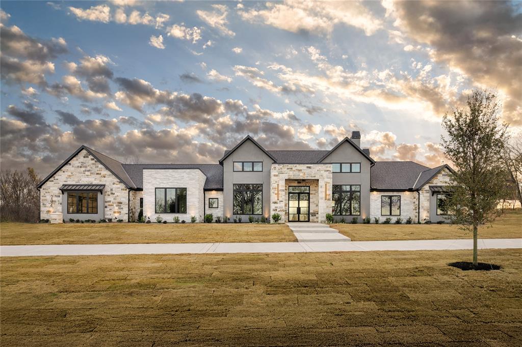 Welcome to this exceptional luxury estate by Ashlyn Homes, nestled in the coveted gated community of Santana Ridge, Weatherford. Situated on a stunning ~2-acre homesite, this 4-bedroom, 4.5-bath residence spans approximately 4,203 sq ft of thoughtfully designed living space. 

As you approach the home, you’ll immediately appreciate the architectural presence, premium finishes, and sense of arrival unique to Santana Ridge—an estate community designed for those who appreciate luxury, privacy and refined craftsmanship.

Inside, the open-concept layout seamlessly connects the grand foyer to the formal living area, chef’s kitchen and generous family room—ideal for upscale entertaining or comfortable everyday living. This home also features a luxurious primary suite, secondary bedrooms with ample space for family or guests, and a thoughtfully placed half bath for convenience.