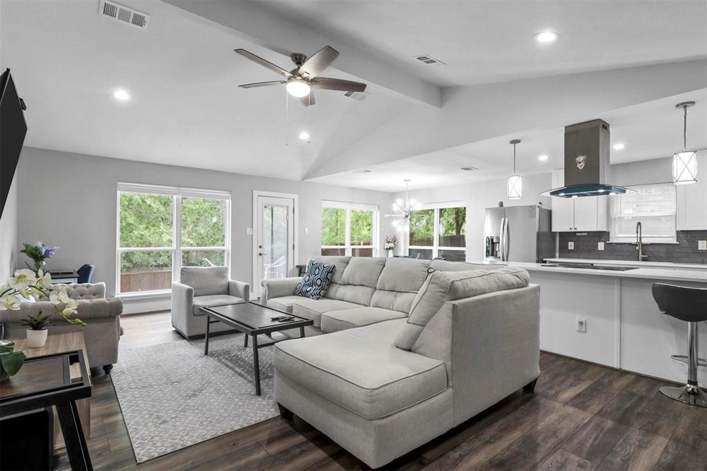 Step into this stunning, recently renovated home flooded with natural light. The heart of the home is the bright and modern kitchen, all appliances were purchased in 2021, making it ideal for food enthusiasts.  This well thought-out floor plan provides 3 bedrooms and 2 full baths. This well-designed layout offers three bedrooms and two full bathrooms. Each room boasts ample natural light, recessed lighting, and contemporary fixtures throughout the entire home. The garage has been transformed, now featuring additional shelving space. 
Updates from 2021-2022 include: kitchen cabinets, flooring, carpet, windows, HVAC, hot water heater, electrical panel, repaired plumbing, fence.
As an added bonus, all fixtures, appliances, security cameras and the custom-built desk in the office will be included with the property.