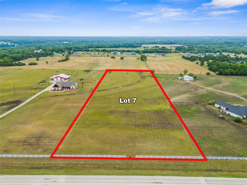 Ready to build your dream home? This fully fenced 3.93-acre lot on the TxDOT-maintained Farm to Market 2729 in North East Van Alstyne offers the perfect blend of country living and convenient access to Hwy 121. Enjoy the benefits of lower Tom Bean ISD taxes, with the option to transfer children to Van Alstyne ISD if desired.

A 10-foot easement with underground water runs across the front of the property, and GCEC power and GCC Fiber Optic are available—perfect for those seeking the tranquility of rural life while working from home. This blank canvas provides endless possibilities to design a custom home with outdoor living spaces, gardens, recreational areas, or even room for a pool, barn, or workshop—bringing your vision of the perfect country lifestyle to life.

This is one of two lots available, offering flexibility and choice. Showings must be scheduled with Broker Bay; no trespassing. This listing is Lot 7.