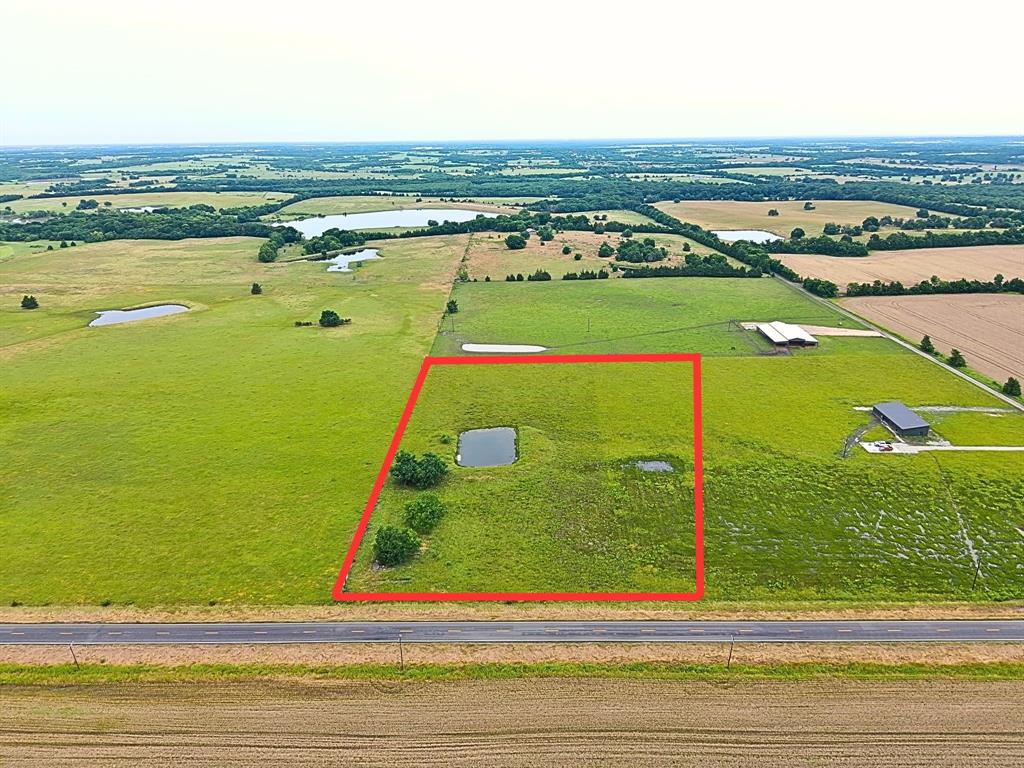 Blank canvas to build your dream home in Chisum ISD!  Property is fenced on 3 sides with a pond.  Water meter on property.
