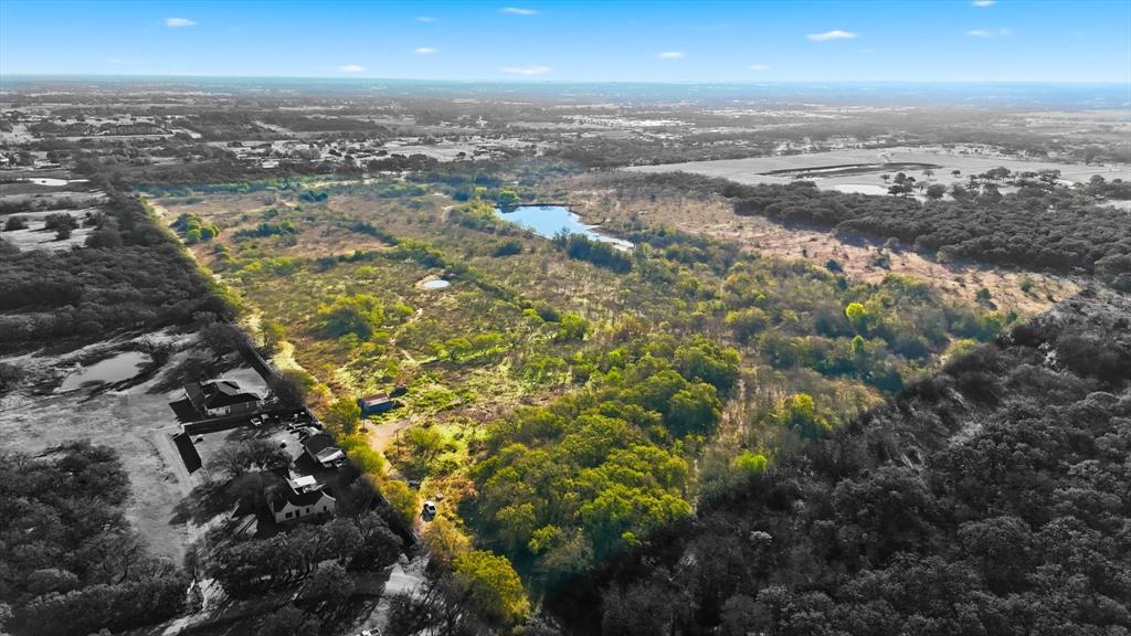Send to your developers! We are in the final round of comments with the city of Joshua. No wasted time waiting for engineering designs and approvals. Price includes all final construction plans. Shady Valley is a 144.244 acre planned residential development property located in Joshua, TX and in Joshua ISD.  The property is fully entitled (approved preliminary plat and zoning) for 94 (1) acre minimum residential lots.  The property contains beautiful large trees (oaks and other species) and a lake.  Significant lot premiums will be obtainable on several lots with lake views, lake frontage and trees. The property is strategically located between Hwy 174 and Chisolm Trail Parkway making it accessible and convenient to Fort Worth and Cleburne.   The property is accessed and has frontage on County Road 1023.