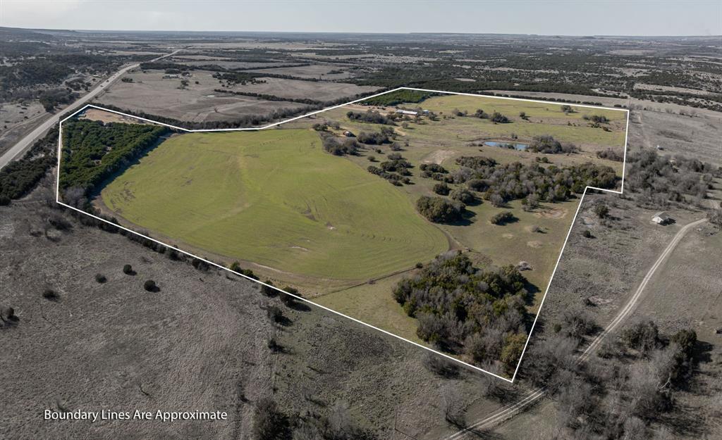 In the heart of Bosque County, this exceptional 116 acre ag exempt ranch offers the perfect blend of rustic charm, functionality, and privacy. The well maintained 3 bedroom 2 bathroom ranch house features quality craftsmanship, warm natural finishes, and a layout designed for both comfort and practicality. Ideal for those who appreciate the ranch lifestyle, this home is welcoming and well appointed.

The land is thoughtfully designed to support a variety of agricultural and recreational uses. A 40x50 drive through covered carport offers ample room for vehicles, tractors, and equipment, while the shop includes an RV height roll up door and RV hookup for extended stays or visiting guests. These features provide valuable flexibility for both work and play.

Set well off the road for added seclusion, the property offers a peaceful setting surrounded by nature. A pond and wet weather creek add both function and scenic appeal. The property also features a barn, livestock pens, and fencing and cross fencing for efficient pasture rotation. Whether you plan to raise cattle, keep horses, or simply enjoy the land, this property is ready to accommodate your vision.

The terrain features a mix of open pasture and mature hardwoods with gently rolling elevation. Native grasses and scattered wildlife contribute to the natural beauty of the property, while the location offers easy access to Meridian, Glen Rose, and Walnut Springs. This is a rare opportunity to own a turnkey ranch property in a highly desirable part of Central Texas.

Owner will consider subdividing approximately 40 acres out of platt 419711. This flexibility adds to the propertys appeal, whether you are looking for a full time residence, weekend escape, or investment opportunity. Bring your horses or cattle and experience the best of Texas ranch living in Bosque County.
