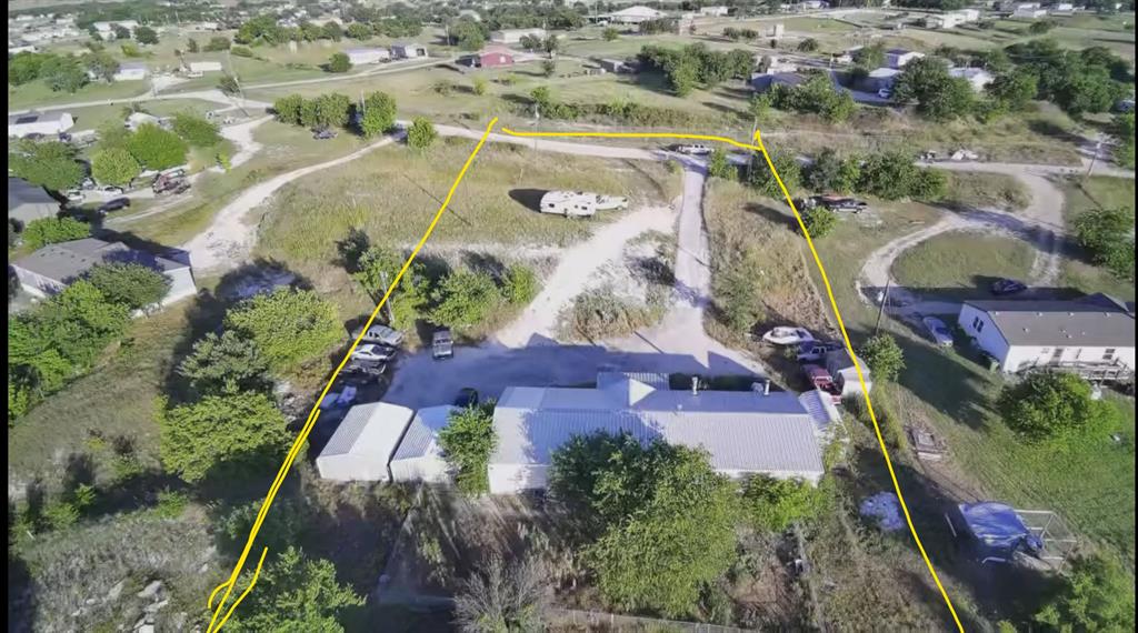 Rare opportunity on 4+ Acres in Growing Wise County! Located in a peaceful rural setting with convenient access to Hwy 287 and the DFW Metroplex, this 4+ acre property offers endless possibilities. The existing home on the land requires extensive repairs and renovations and is being sold as-is. Whether you choose to completely renovate, rebuild, or start fresh with a new home, this property provides the space and flexibility to bring your vision to life. Features include two natural gas tanks and plenty of room to expand, build additional structures, or enjoy country living with room to roam. Includes an easement to part of the property.