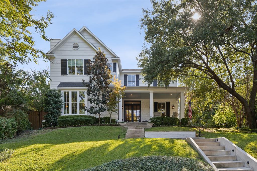 Perched on a scenic hilltop in Lakewood and just a short walk from White Rock Lake and YMCA, this picturesque home combines charm and modern luxury. The inviting front porch opens through French doors to formal dining room and entryway, leading into spacious living room with cozy fireplace & window seat overlooking the lush front lawn. Formal dining is open to second living room & adjoined to kitchen via butlers pantry with wine fridge. Chef's kitchen is complete with walk in pantry, built in fridge, double ovens, gas cooktop and breakfast room. First floor primary suite is a luxurious retreat with spa-like bath featuring dual sinks, soaking tub, oversized steam shower and walk-in closet. Upstairs a third living area and four beds served by three baths offer ample space and convenience. Upstairs, you'll also find a 500 sf attached guest quarters with a private exterior entrance, featuring a full kitchen, stacked laundry area, walk-in closet, and full bathroom. Outdoor entertaining is a breeze with screened porch with access to half bath, pool, built-in grill, turfed lawn and pergola. Additional amenities: study with built-ins, two half baths, full size laundry room, and two car garage.
