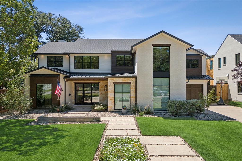 Located on one of the most sought-after streets in White Rock Valley, this home epitomizes custom craftsmanship. This Hill Country Modern residence showcases white oak hardwoods and walls of windows that bathe the home in natural light. The open-concept layout seamlessly integrates a gourmet kitchen, complete with professional appliances and bespoke designer lighting. The main-floor primary suite is a sanctuary, offering double vanities, a freestanding tub, and a glass-enclosed shower, and closet with discreet pass-through to the utility room. The study, adaptable as the 5th bedroom, reflects the home’s thoughtful design. Upstairs, three generously proportioned bedrooms and a light-filled game room boast vaulted ceilings, while a substantial unfinished attic provides the potential for a sixth bedroom. The split three-car garage and covered patio with an outdoor half bath further elevate this exceptional property. A true masterpiece!