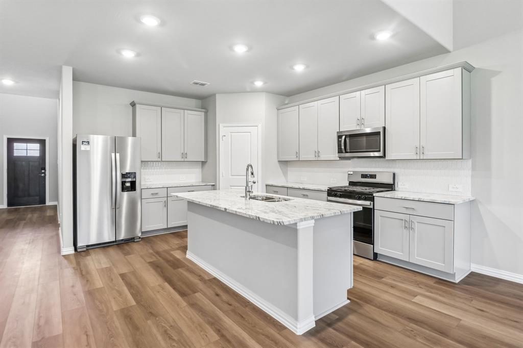 BRAND NEW energy - efficient home Aug 2026! Skip the theater and enjoy movie night at home from the comfort of the Kessler's second-story game room. Pebble cabinets with marble-look white granite countertops, beige tone EVP flooring and multi-tone grey carpet. New energy-efficient move-in ready homes in Dallas-Fort Worth include a washer, dryer, fridge, and whole home blinds, plus they can be closing-ready in 60 days or less–guaranteed. Have it all: Relax in your private primary suite, enjoy the covered back patio, and our open concept floorplans, all with easy access to Fort Worth, Arlington, and Grapevine.