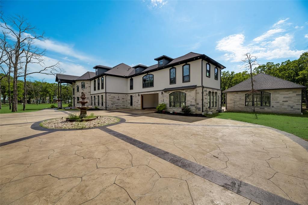 Grand luxury estate boasting over 10,000 sq ft with immense detail and high end upgrades throughout. This estate is nestled in a quiet gated community of less than 25 lots. With so many features and upgrades you will want to see this home for yourself. Settled just minutes from the city in the small and growing town of Royse City, TX. Grand entryway with dual winding staircases showcase this home as soon as you walk in. Large open  floorplan and plenty of space for large gatherings. If cooking and entertaining are your thing you will enjoy the chefs kitchen with a 6 burner gas range, double stacked granite countertops along with commercial grade appliances and farmhouse style sink. Outdoor entertaining at its finest with inground pool, water features and slide. Take your cooking skills outside with a full outdoor kitchen featuring commercial grade built-ins.  With so many features and upgrades please contact listing agent for a complete list.