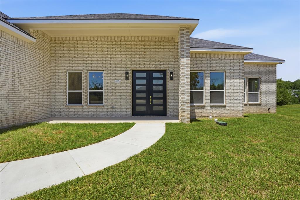 Tucked away on a cul-de-sac in the gated golf course community of Pecan Plantation this 2025-built home offers space flexibility & the chance to enjoy one of Granbury’s most amenity-rich neighborhoods on nearly an acre. Short drive from both the front & back gates the property offers easy access in & out of Pecan. 4 beds 3 full baths & a thoughtfully designed split-bedroom floorplan the layout was created with both functionality & privacy in mind. The soaring 12’ ceilings & oversized picture windows create an open feel while filling the living & dining areas with natural light. The heart of the home offers generous gathering space for everyday living or entertaining. Standout feature of the home is the dual primary suite design with one primary bedroom positioned on each end of the home. Ideal for multigenerational living long-term guests or buyers who simply value privacy & flexibility. Main primary suite includes dual closets & en-suite bath with garden tub & separate shower while the 2nd primary suite also offers its own private bath. Secondary bedrooms are well-sized & positioned to maximize functionality throughout the home. Built with comfort and efficiency in mind the home is foam encapsulated to help improve energy performance & year-round efficiency. Buyers will enjoy added peace of mind with a builder's 1-2-10 warranty included. The nearly 1 acre lot provides space to expand outdoor living areas, create a backyard retreat, or simply enjoy the extra elbow room that is becoming harder to find. 3-car garage offers ample storage, parking or workspace flexibility. This home is a strong option for buyers looking for square footage with a modern floorplan & desirable location. Residents of Pecan Plantation enjoy unmatched amenities including golf, country club dining, pools, tennis, pickleball, parks, walking trails, equestrian facilities, marina, private airstrip  & gated security all located minutes from the Granbury square shopping, dining & entertainment.