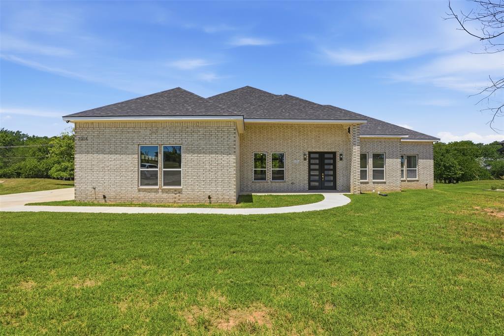 Discover the perfect blend of modern design, flexible living, and nearly an acre of space in this 2026 built home tucked away on a quiet cul-de-sac in Pecan Plantation. Featuring 4 bedrooms, 3 full baths, and a thoughtfully designed split-bedroom floor plan, this home offers soaring 12-foot ceilings, oversized picture windows, and an open-concept living area filled with natural light. A rare dual primary suite layout makes this home ideal for multigenerational living, extended guests, or anyone seeking added privacy. The main primary suite features dual walk-in closets and a spacious ensuite with a soaking tub and separate shower, while the second primary suite includes its own private bath. Two additional bedrooms provide flexibility for family, guests, or a home office. Designed for comfort and efficiency, the home is foam encapsulated to help improve year-round energy performance and includes a builder's 1-2-10 warranty for added peace of mind. The nearly one-acre lot offers endless possibilities for a pool, outdoor entertaining, or simply enjoying extra space that's becoming increasingly difficult to find. A 3-car garage provides plenty of room for vehicles, storage, or hobbies. Located in the gated community of Pecan Plantation (short drive to either gate), residents enjoy exceptional amenities including golf, country club dining, swimming pools, tennis, pickleball, parks, walking trails, equestrian facilities, a marina, private airstrip, and 24-hour security. Just minutes from the Historic Granbury Square, shopping, dining, and entertainment, this home offers the space, flexibility, and lifestyle today's buyers are searching for.