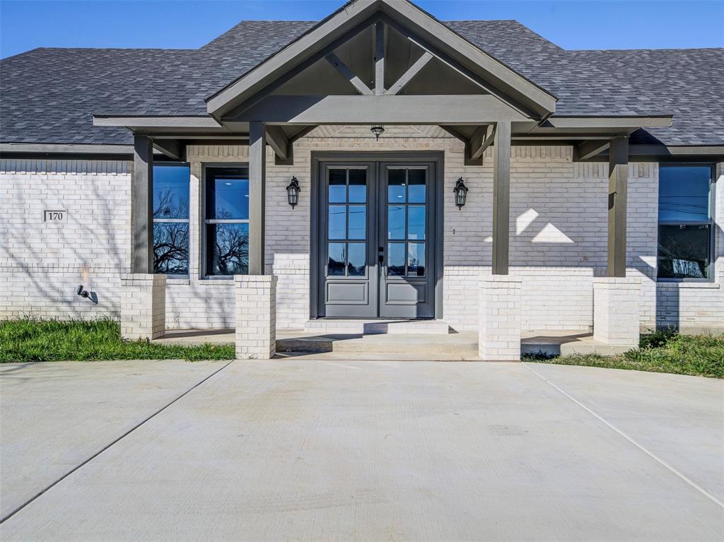 Stunning New Construction in the Beautiful Lake Community of Runaway Bay!  This brand new 4 bedroom, 2 bath home is perfectly positioned on a desirable corner lot with lake views.  From the grand circular driveway entrance, to the double glass front doors, every guest will be greeted with style!  This thoughtfully designed home offers all of the modern touches as well as functionality.  The open concept layout features separate laundry room, 9 foot ceilings, recessed lighting, and luxury vinyl flooring throughout.  The living area is spacious and flows into the kitchen with direct access to the 2 car garage for convenience.  The split bedroom floor plan provides privacy, with a spacious primary suite boasting double walk-in closets, and an ensuite bath featuring dual sinks, quartz countertops and ample storage. Enjoy peaceful lake community living with modern luxury in this brand new move in ready home located just steps from Lake Bridgeport!