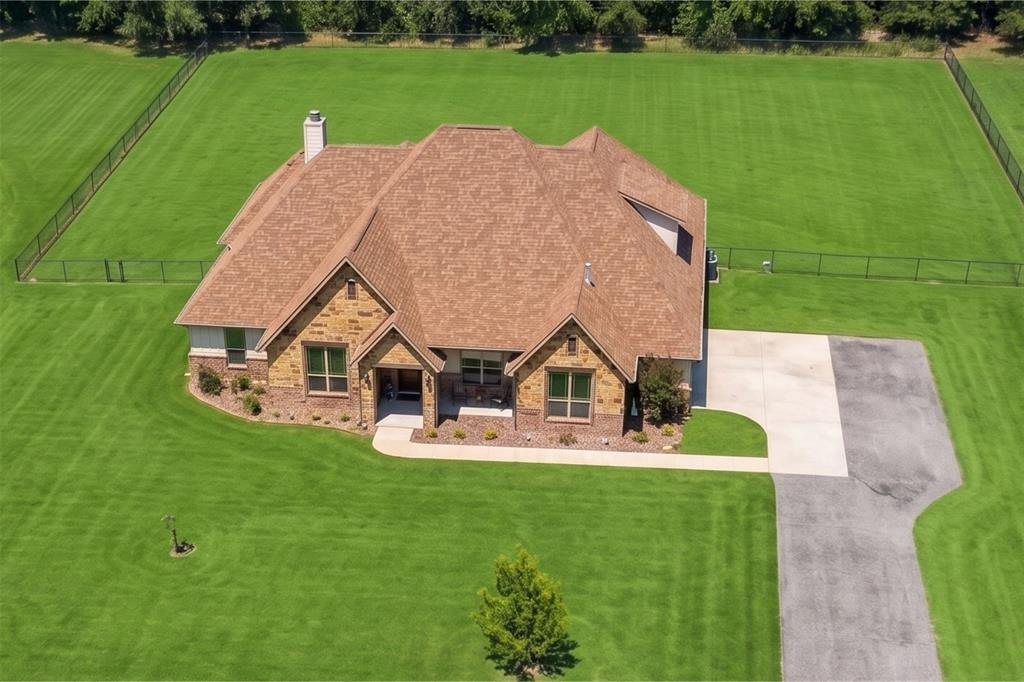 Welcome to this stunning custom-built home perfectly situated on 2.5 acres at the end of a quiet cul-de-sac, offering both privacy and space to enjoy. This thoughtfully designed 4-bedroom, 3.5-bath residence blends timeless style with modern comfort.
The home showcases beautiful stone and board-and-batten exterior details, complemented by neutral tones throughout the interior. Inside, you’ll find new carpet in all bedrooms, quartz countertops, stainless steel appliances, custom fixtures, and solid wood cabinetry that elevate both form and function.
Designed for flexibility and entertaining, the layout includes a dedicated home office and an expansive upstairs retreat featuring a bonus room, full bath, and media room—perfect for guests, hobbies, or movie nights.
Step outside to your own private oasis with a diving pool, relaxing spa, and fenced yard, ideal for gatherings or peaceful evenings at home. A rare golf cart garage adds convenience and extra storage.
Located in a highly desirable community known for its state champion football program, this home is also zoned to a new state-of-the-art elementary school, with a brand-new high school coming soon—making it an excellent choice for future growth and value.
This one-of-a-kind property offers the perfect balance of luxury, comfort, and location—don’t miss the opportunity to make it yours.