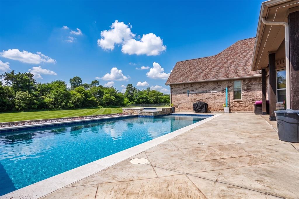Welcome to this stunning custom-built home perfectly situated on 2.5 acres at the end of a quiet cul-de-sac, offering both privacy and space to enjoy. This thoughtfully designed 4-bedroom, 3.5-bath residence blends timeless style with modern comfort.
The home showcases beautiful stone and board-and-batten exterior details, complemented by neutral tones throughout the interior. Inside, you’ll find new carpet in all bedrooms, quartz countertops, stainless steel appliances, custom fixtures, and solid wood cabinetry that elevate both form and function.
Designed for flexibility and entertaining, the layout includes a dedicated home office and an expansive upstairs retreat featuring a bonus room, full bath, and media room—perfect for guests, hobbies, or movie nights.
Step outside to your own private oasis with a diving pool, relaxing spa, and fenced yard, ideal for gatherings or peaceful evenings at home. A rare golf cart garage adds convenience and extra storage.
Located in a highly desirable community known for its state champion football program, this home is also zoned to a new state-of-the-art elementary school, with a brand-new high school coming soon—making it an excellent choice for future growth and value.
This one-of-a-kind property offers the perfect balance of luxury, comfort, and location—don’t miss the opportunity to make it yours.