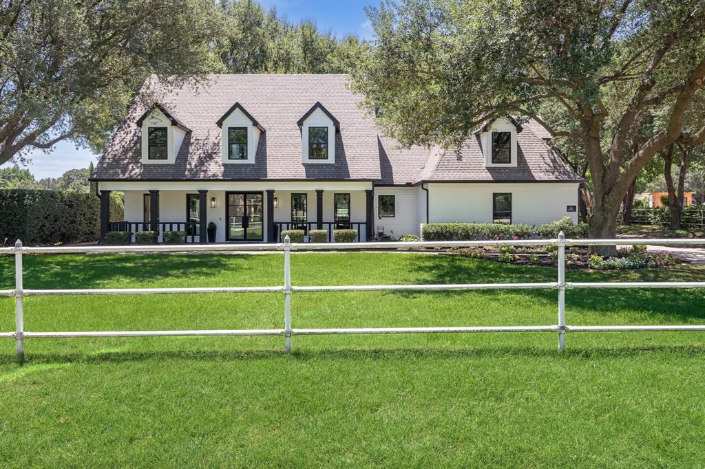 Experience the perfect balance where modern sophistication meets classic Texas charm at this beautifully reimagined property in the heart of Colleyville. Set on lush acreage shaded by mature trees, this exceptional property combines a fully renovated modern farmhouse with equestrian-friendly amenities—creating a rare offering in one of DFW’s most coveted communities.

Step inside to discover an open, airy floor plan where natural light pours through expansive windows, framing serene views of the grounds. The chef’s kitchen is the centerpiece of the home, featuring custom cabinetry, premium appliances, and a striking island that seamlessly connects to the living and dining areas. The living room is anchored by a sleek fireplace and flanked by built-in shelving, making it as stylish as it is inviting.

The first-floor primary suite offers a private retreat, complete with a spa-inspired bath featuring a soaking tub, dual vanities, and dramatic black-and-white marble. Upstairs, you’ll find three additional bedrooms, a spacious family room with a bar, and flexible space for relaxation or play.

Work-from-home days are elevated by the dedicated office, while wide-plank hardwood floors throughout bring warmth and continuity to every room.

Outside, the property opens up to an expansive patio perfect for entertaining, a fenced pasture, and a well-maintained barn with stalls, ideal for horses or hobby livestock. The land offers endless possibilities—whether you dream of gardening, riding, or simply enjoying the peaceful setting beneath the shade of mature oaks.

Located just minutes from top-rated Colleyville schools, shopping, and dining, yet offering the privacy and space of true country living, 511 Shelton Drive is more than a home—it’s a lifestyle.