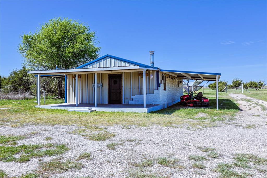 *****All offers due by June 10th at 2:00PM*****
2 bedroom, 1 bath barndominium featuring a cozy wood burning fireplace, excellent insulation, and a comfortable eat in kitchen. There is also a versatile bonus room that can be used as an office, podcast space, nursery, or flex room to suit your needs. The property has been well maintained, with all 9 acres thoughtfully cleared and cared for. Enjoy a charming picnic area surrounded by blueberry, apple, pear, and raspberry trees. Additional features include a wood log shed fully stocked with oak, a 1300 gallon water storage shed, and a fenced area with a water trough for animals. Solar panels, owned by the sellers, can be included or excluded based on buyer preference. The seller services the water well and septic system at least once per year, ensuring consistent performance and quality. Come experience affordable country living with everything you need, and nothing you don’t.