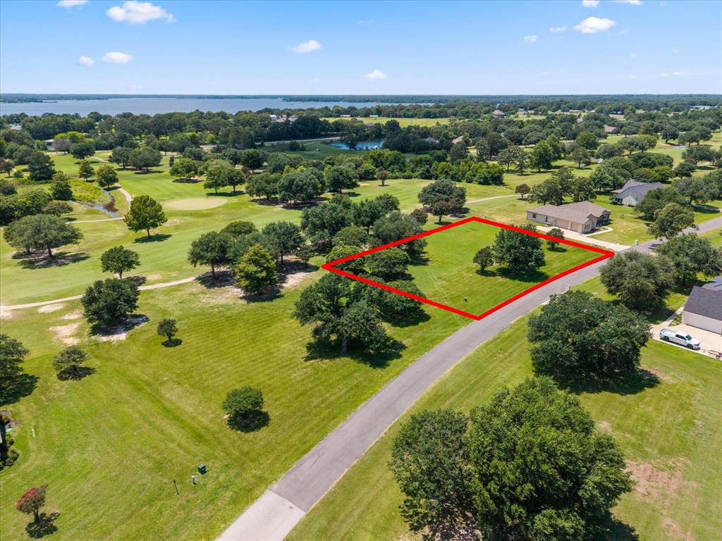 Build your dream home on this exceptional homesite overlooking the beautiful Lake Fork Golf Course! Enjoy the perfect blend of peaceful country living and resort-style amenities in this family-oriented community. The challenging 18-hole golf course features a full-service clubhouse, making it easy to spend the day golfing, dining, and relaxing close to home. Located on the west banks of the world-famous Lake Fork Reservoir, known as the Bass Capital of Texas, you’ll have incredible fishing and boating opportunities just minutes away. Conveniently situated only about an hour from the DFW Metroplex, this build-ready lot offers the ideal escape for a weekend retreat or your forever home. Don’t miss this opportunity to own property in one of East Texas’ premier golf and lake communities. Lot 15 that sits next to this one for sale also.