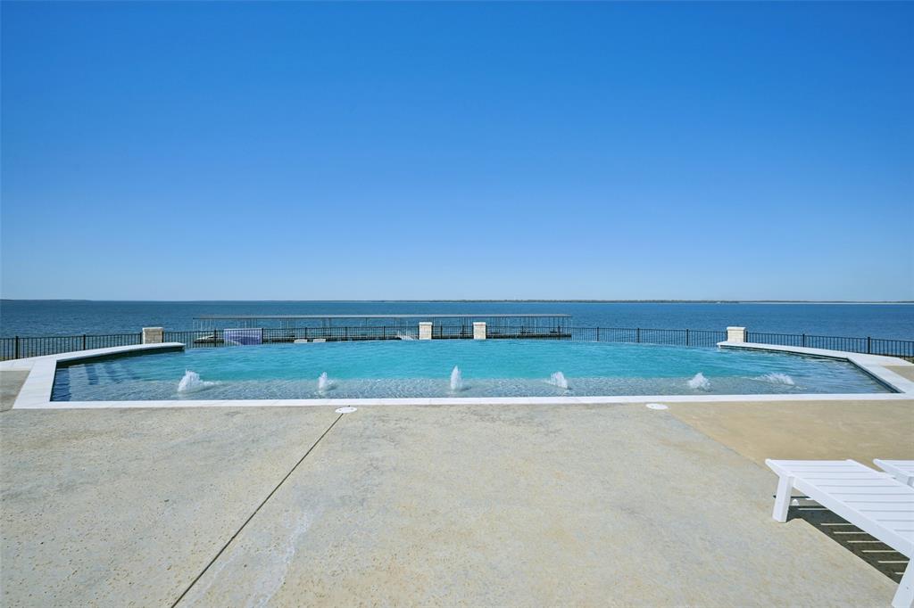 Stunning 1.58 acre waterfront lot ready for you to build to suit your needs. On the shores of Bois D'Arc Lake, this gorgeous expanse of unimproved land stretches from Shores Road to the lake, offering an ideal setting to build your dream home! Imagine watching the sunset from your back porch or designing your landscaping around the pristine natural shoreline. This is a one-of-a-kind opportunity is in an exclusive private community on a private road with limited waterfront lots.  The modern community Clubhouse includes wonderful amenities to enjoy including a stunning pool and patio, workout facility with state of the art equipment, putting greens, outdoor grill and BBQ area, and banquet facilities! Don't miss out on the beautiful lot! LOCATED AT SHORES AT THE PENINSULA.
