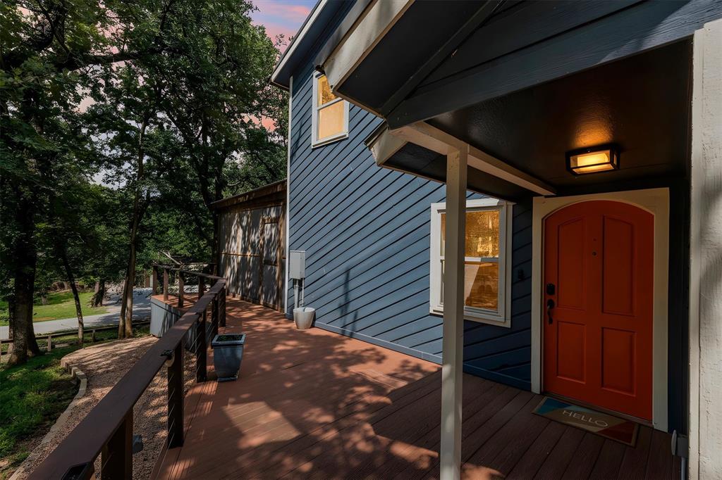 Some homes sit on a lot. This one lives among the trees.
Perched atop one of the highest points on the property, this distinctive 4-bedroom, 2.5-bath home is surrounded by more than 20 mature post oak trees, creating a setting that feels worlds away from the ordinary. Nearly every window frames a view of the canopy, blurring the line between indoors and out and giving the home a treehouse-like atmosphere that's increasingly hard to find.
The home's open-concept design offers spacious gathering areas filled with natural light and views in every direction. Whether you're hosting friends, enjoying a quiet morning coffee, or simply watching the seasons change through the trees, the connection to nature is ever-present.
The true showstopper is the expansive screened-in porch—a destination all its own. With generous seating areas and a sunken hot tub nestled beneath the canopy, it's the perfect place to unwind, entertain, or enjoy a summer thunderstorm from the comfort of a covered retreat.
Just moments from Sunset Point and the shores of Lake Lewisville, the property carries the relaxed feel of a lakeside getaway. Between the towering oaks, elevated setting, and sweeping views of the surrounding trees, everyday life here feels more like a weekend at a lake house than a home in the heart of the Metroplex. Better yet, the boat ramp is just a five-minute drive away, making spontaneous days on the water remarkably easy.
Beyond its charm, the home offers thoughtful upgrades including a durable metal roof, Tesla EV charger, epoxy-coated garage floor, built-in garage workbench, and a storage shed situated on a poured concrete pad. The wide driveway provides ample space for additional vehicles and can easily accommodate a boat or RV. And with no HOA, you'll enjoy the freedom to make the most of your property.
If you've been searching for something with character, privacy, and a true sense of escape, this is more than a house—it's a lake retreat among the trees.