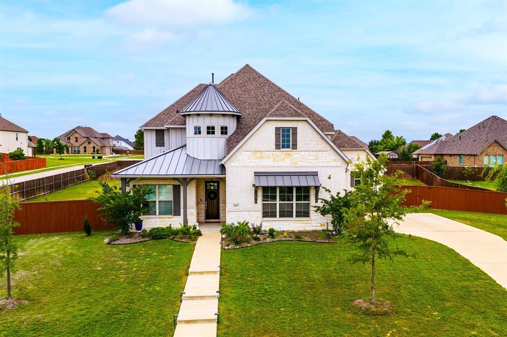 Sunnyvale, where small-town charm is a lifestyle. Just 15 miles from Downtown Dallas, this exclusive enclave offers a rare upscale retreat with sprawling estates & immediate access to Lake Ray Hubbard for weekend recreation. Sunnyvale is North Texas’s premier destination for those who want expansive space without sacrificing city convenience. Have kids? Welcome to the prestigious Sunnyvale ISD. Come see this Stately Home with 4 Big Bedrooms, 4.1 Baths, Office, Media, Game rooms, including a Mother-In-Law Suite. Just like people, you get attracted by the exterior of this home & then fall in LOVE when you get to know the inside. Walk by the inviting front porch & then you're enthralled by the soaring ceilings. Both the Primary Bedroom Suite & Mother-In-Law Suite are on the 1st floor, strategically placed on opposite ends of the home to maximize privacy. As you continue into the home, you will notice an expansive Dining room on the left & more soaring ceilings on your right above the jumbo sized living room! The living room is open to the Eat in Kitchen with beautiful cabinetry & focal point island. You must come see all the details throughout this home. Just off to the corner is the office with it's 18ft wall with large windows. The great thing is that the home faces South, so you get to enjoy windows all along the back, living room, Primary bedroom, etc while the hot sun bearing down on them. The upstairs Game room overlooks the living room & 2 story windows. It leads to the Media Room that has an extra space ready to install a beverage & popcorn station. Or, if you work out, the space could be your smoothie station full of refreshments. The media room could also be used as a very large 5th Bedroom with walk in closet and study nook if you swap out the window for a casement window. The yard is large enough to host field sports.  The 85ft driveway is long enough to park boats, trailers, RV's... With the over half ACRE of land, build your dream workshop or RV garage.