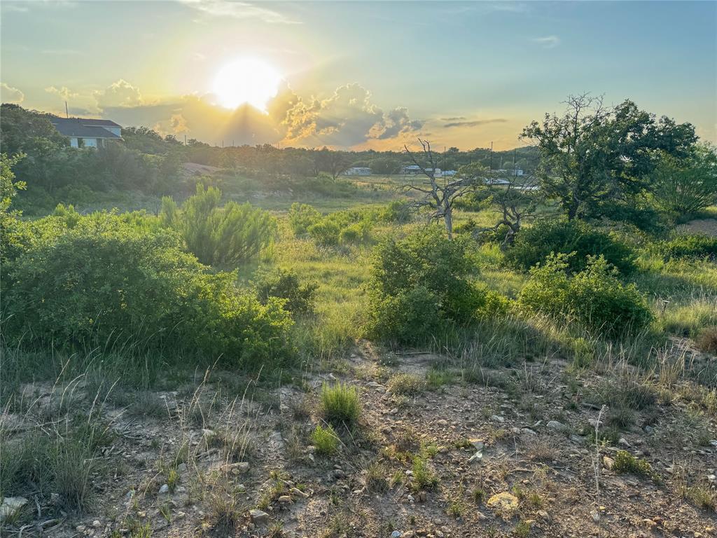 Own your lakeside escape in the Hidden Shores Subdivision at Lake Cisco!  Lot 8 is a waterfront property when the lake is full, providing the perfect setting for a weekend retreat or future lake home. Enjoy unbelievable sunsets over the water each evening on this spacious 1.17 acre lot which offers plenty of room to create your ideal getaway and includes a nice boat dock.  A septic system will be required. Don't miss this opportunity to own a scenic lake property at Lake Cisco!