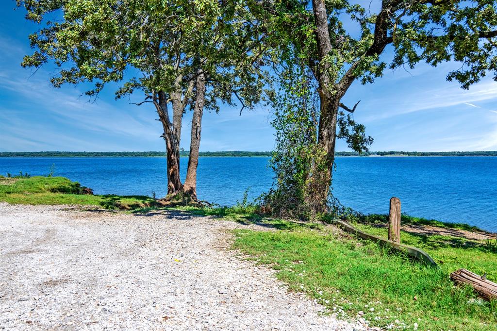 Charming 3-Bed, 2-Bath Lake Texoma Retreat on Two Wooded Lots
Welcome to your peaceful getaway near Lake Texoma! This charming two-story home features 3 bedrooms and 2 full bathrooms, nestled on two beautifully wooded lots that offer privacy and space to relax. Enjoy the outdoors from the large deck — perfect for morning coffee, entertaining, or soaking in the serene surroundings, 2 cover space carport, large finished attic that could be extra playroom or storage.
Located just minutes from the lake, this property is ideal as a full-time residence, weekend escape, or vacation rental. With plenty of trees, nature, and a great location, it’s the lake lifestyle you’ve been looking for!
Don’t miss this opportunity — call today for a private showing!