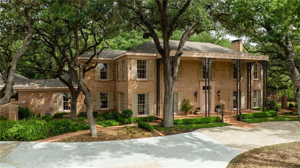 - Along one of Waco’s most respected drives, past the cottages and large midcentury moderns of Lake Air Estates and the majestic streets of Old Oaks, sits this prominent community focal point. With over 4800 sf feet in total with a fully equipped guest apartment included, on over an acre and a half - this Waco home is incomparable.

- Set back on the exceptionally large lot and peeking through hundred year old live oak trees, visitors are greeted by a distinguished wrought iron tracery and columns framing a southern French style front porch. The entire estate has been meticulously restored. Refinement continues with its interior, electrical, plumbing, HVAC including ductwork as well as each artistically selected finish and surface, with close attention to detail throughout. Welcoming you with a sweeping staircase and hardwood floors, the classical foyer is framed with formal dining and living spaces to your left and right. Each space is richly ornate with details such as the intricate cornices above each floor to ceiling window, providing stunning views of the surrounding gardens and sprawling lawns, as well as an elegant, marble, wood burning fireplace that centers the large room in a perfect flourish.
 
- The second living area in the rear of the home is comfortably suited and open to the kitchen allowing for easy, more casual living and entertainment. A hidden powder room is adorned with a Sherryl Wagner sink and Artos tap adding elegance to necessity. The large, original, bay window with copper roof and French doors exit to the south and bring the back gardens and brickwork inside to give warmth and living artwork to the otherwise sheltered space.

- Masterfully crafted wood floors have been extended through the informal dining area towards the kitchen, where a new 10 foot quartersawn oak island, topped with artistically shaped quartzite anchors the kitchen.

- As you move forward, the left side features thoughtfully designed craftsmanship and storage wi